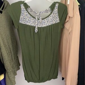 Forest green top with blue flower design on chest